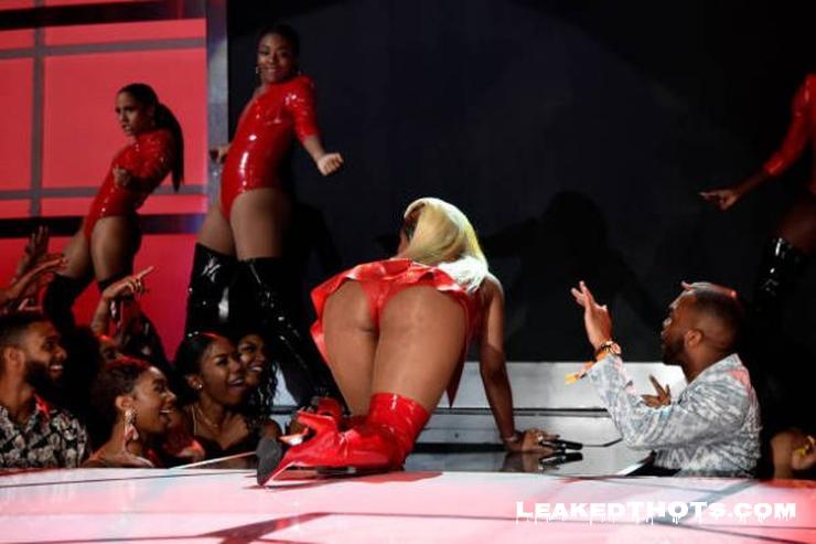 Nicki Minaj on her knees